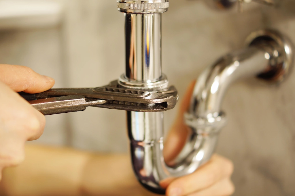 Fixing pipe leaks to prevent termite entry