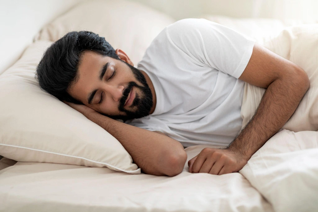 Person sleeping peacefully on a clean mattress,